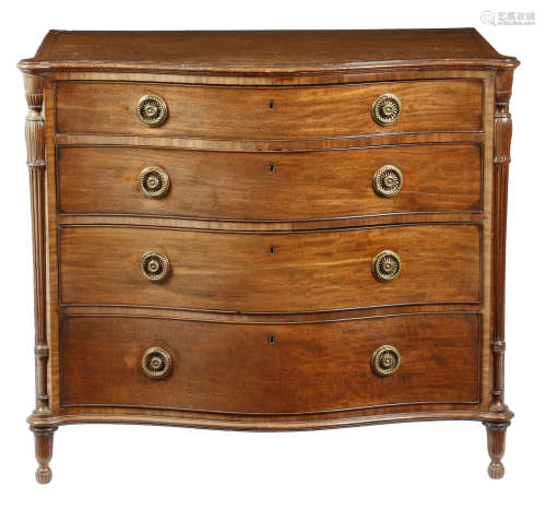 A George III mahogany serpentine chest in the manner of Chippendale and Haig, the crossbanded top