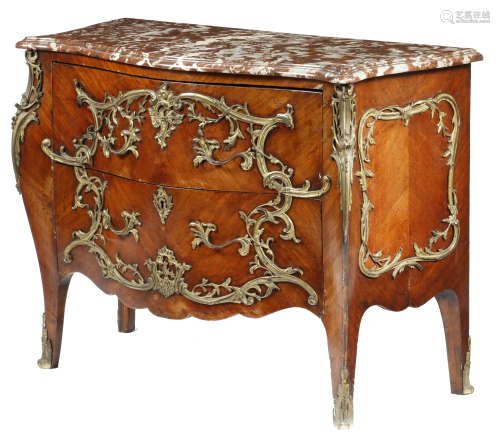 A kingwood bombe commode in Louis XV style, with scrolling leaf ormolu mounts, the serpentine marble