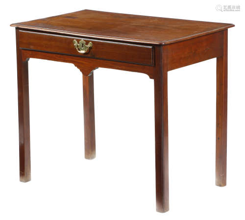 A George II mahogany side table, fitted with a frieze drawer, above a shaped apron and on moulded