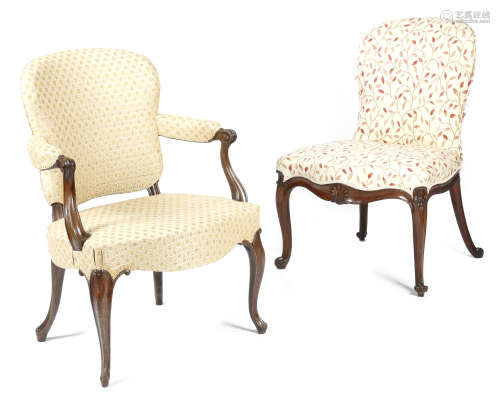 A George III mahogany open armchair in French Hepplewhite style, with a cartouche shape padded back,