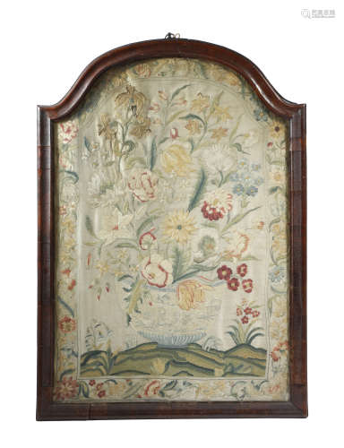 An early 18th century embroidered silkwork still life picture, of flowers in a blue and white