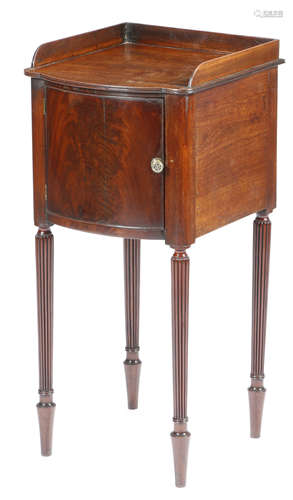 A Regency mahogany bowfront bedside cupboard in the manner of Gillows, with a three quarter