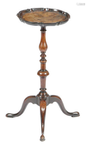 A late George II mahogany wine stand, the circular top with a pie-crust moulded edge, on a