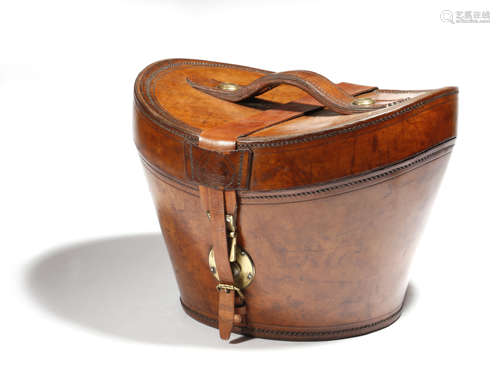 A brown leather bucket shape hat box by Greaves, with brass mounts and with a green silk lined