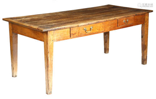 A 19th century French cherrywood farmhouse kitchen table, the boarded top with cleated ends, with