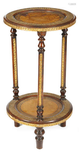 A continental stained wood and gilt composition gueridon, with two tiers, each inset with gilt