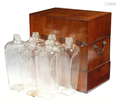 An early George III mahogany decanter box, the hinged lid revealing six tapering glass decanters,