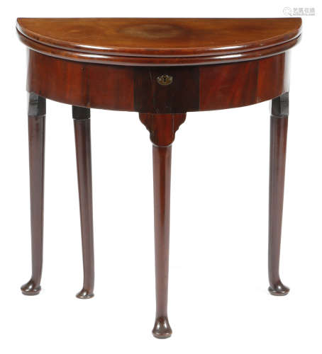 A George II red walnut demi-lune tea table, the twin hinged top revealing a vacant interior and on a