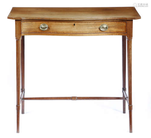λ A George III mahogany serpentine side table, fitted with a rosewood banded frieze drawer,