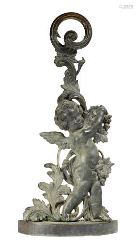 A Victorian patinated bronze doorstop, depicting a winged cherub holding a grapevine, with scrolling