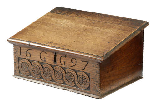 A William and Mary oak table desk, the hinged sloping lid fitted with a compartment for pens,