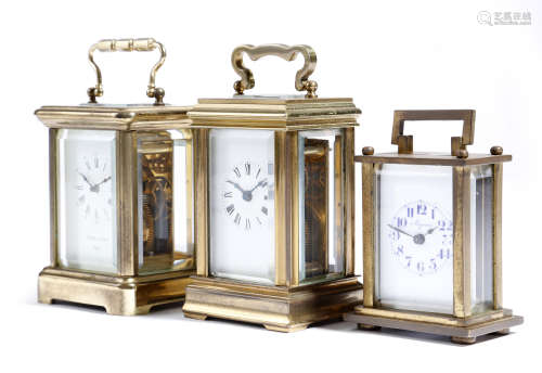 Three miniature brass carriage clocks, the dial of one inscribed 'PIERRE JACOT PARIS', one with