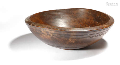 A Victorian treen turned sycamore dairy bowl, 16cm high, 45.6cm diameter.