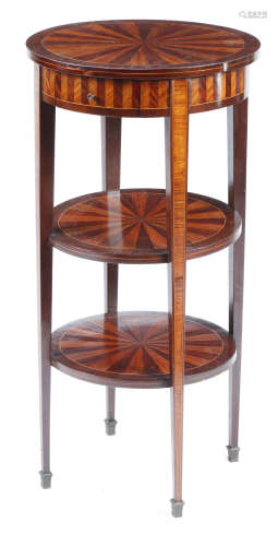 A French mahogany and kingwood lamp stand, with three circular tiers, with segmented veneers, with a