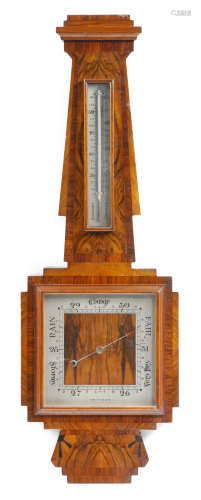 An Art Deco walnut barometer, with a silvered dial and thermometer, 81.4cm long. Provenance: The