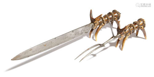 A Victorian steel and antler carving set, comprising: a knife and a fork, with a hinged guard,