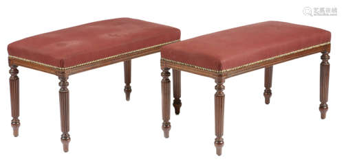 A pair of 19th century mahogany stools, each with a stuffed-over studded seat, on turned and