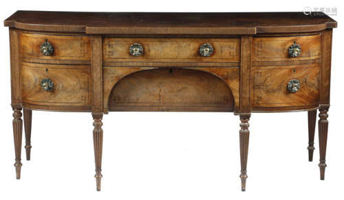 A Regency mahogany sideboard, inlaid with ebonised stringing, the top with a reel moulded edge,