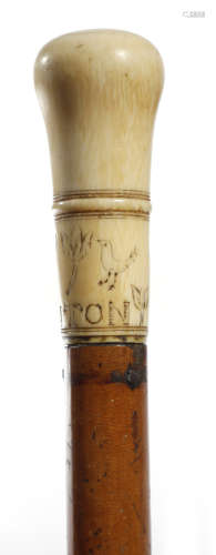 λ A Queen Anne ivory handled walking cane, dated '1700' and engraved with tulips and a bird and the