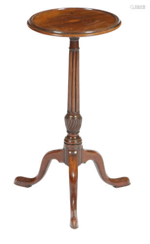 A mahogany tripod wine table, the dished fixed top on a cluster column stem, on cabriole legs and