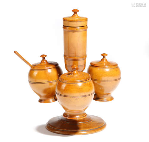 A Victorian treen boxwood cruet, with four lidded condiment and salt holders and with a spoon, 15.