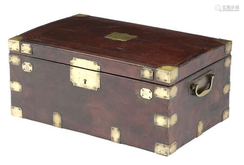 A 19th century French red leather jewellery case, with brass mounts, the hinged lid with a shield