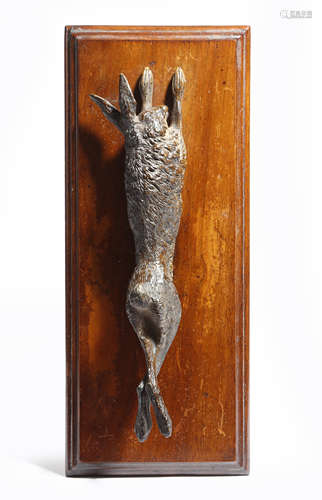 An Austrian cold painted bronze dead game paperclip, modelled as a hare, mounted on a walnut