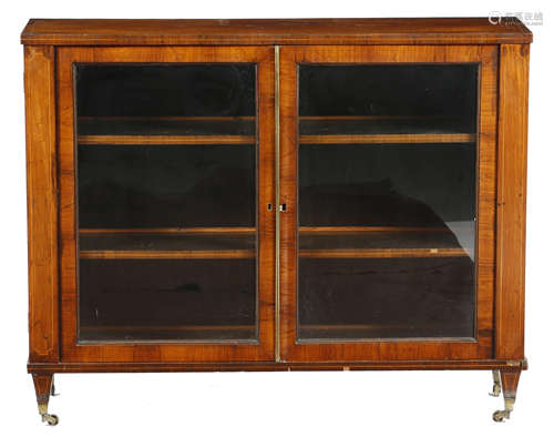 λ A late George III rosewood side cabinet, inlaid with boxwood stringing, with a pair of glazed