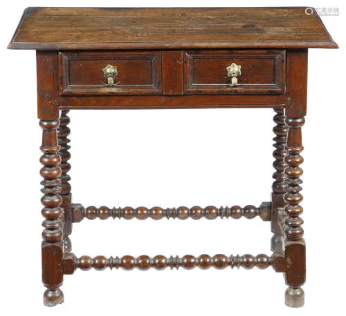 A William and Mary oak side table, the top with a moulded edge, above a frieze drawer with a