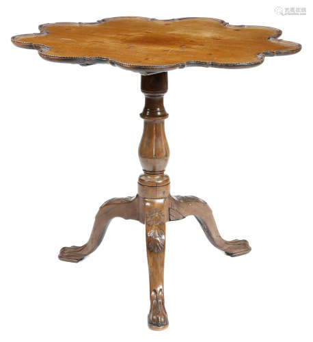 An Irish mahogany tripod table, the lobed tilt-top with a moulded and cable edge, on a faceted stem,