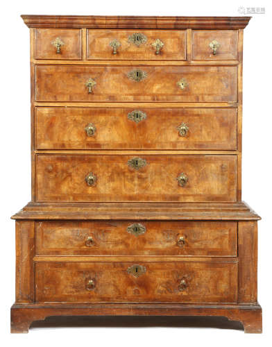 A George II walnut chest on chest, with three short and five long cross and feather banded