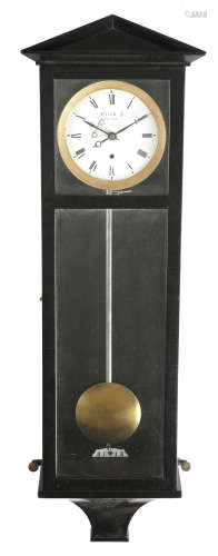A small Vienna regulator style wall clock, the brass five day movement with an enamel dial with