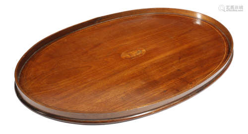 A George III mahogany oval tray, inlaid with boxwood stringing, the centre with an oval kingwood