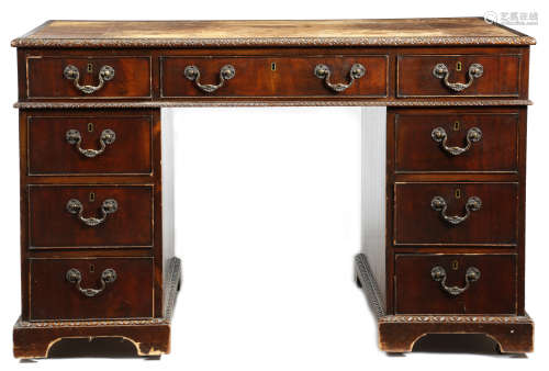 A mahogany twin pedestal desk in Chippendale style by Spillman, the top inset with a tooled
