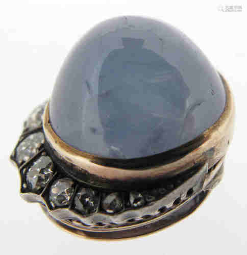 A star sapphire and diamond clip, the cabochon sapphire weighs approximately 40.00cts, within