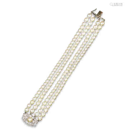 A cultured pearl and diamond bracelet, the four row bracelet terminating with an Art Deco cultured