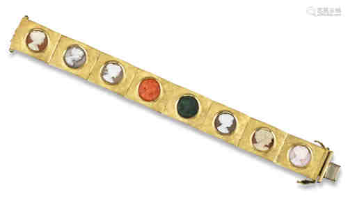 A gold cameo bracelet c1970, each textured gold rectangular link set with a carved cameo of a female