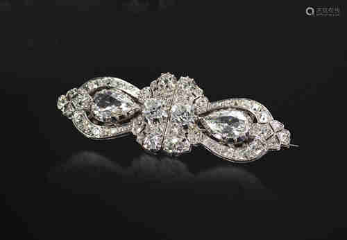 A diamond-set double clip brooch, each detachable clip is set with a pear-shaped diamond within a