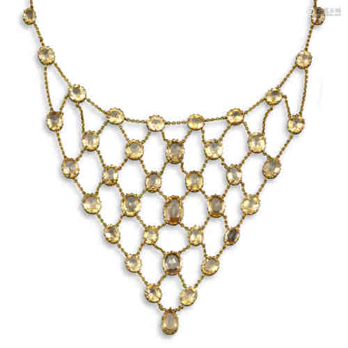 An Edwardian topaz fringe necklace, set with graduated oval-shaped orange topaz joined with fine-
