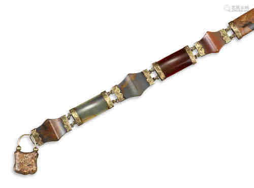 A Scottish agate bracelet, set with six agate panels joined with carved gold terminals and agate