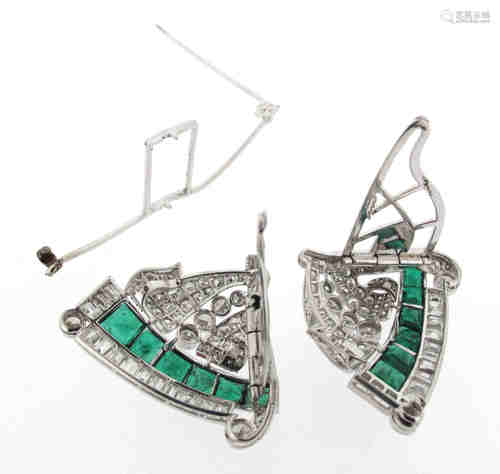 A pair of Art Deco emerald and diamond-set clip brooches, each clip set with a line of graduated