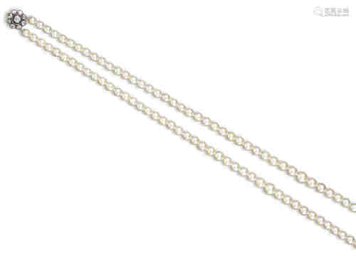 A two row cultured pearl necklace, set with a sapphire and diamond cluster clasp, the central