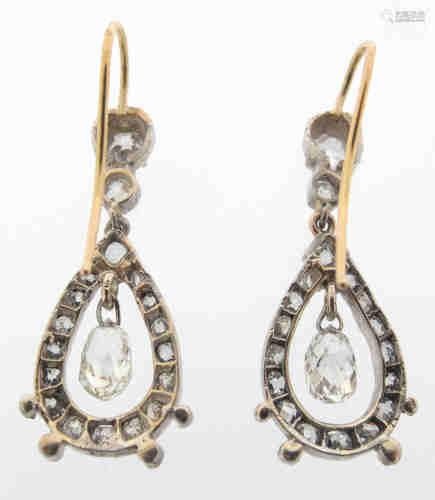 A pair of diamond-set drop earrings, each mounted with a pear-shaped pendant set with graduated