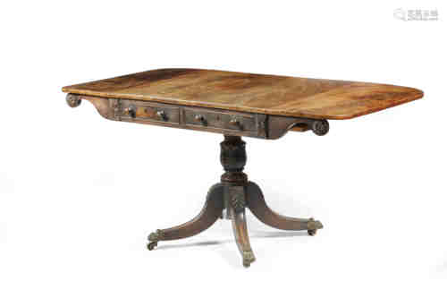 A Regency mahogany sofa table, the flame veneered drop-leaf top above a pair of cedar lined long