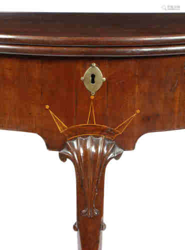 A George II mahogany demi-lune tea table, the hinged top on a single gate support, the shaped frieze