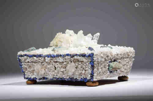 An unusual mineral and quartz encrusted casket of sarcophagus shape, the lid with a central quartz