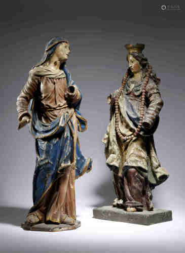 Two European carved wood and polychrome decorated figures of the Virgin Mary, with parcel gilt