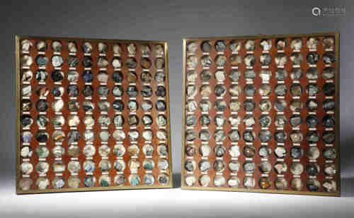 A pair of wall hanging mineral display cases, each containing one hundred numbered mineral