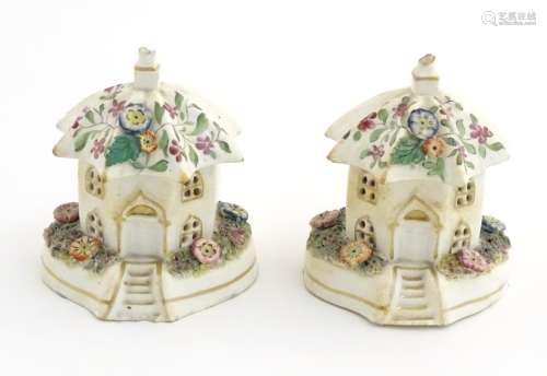 A Staffordshire pottery pastille burner in the form of a cottage, decorated with flowers. Approx.