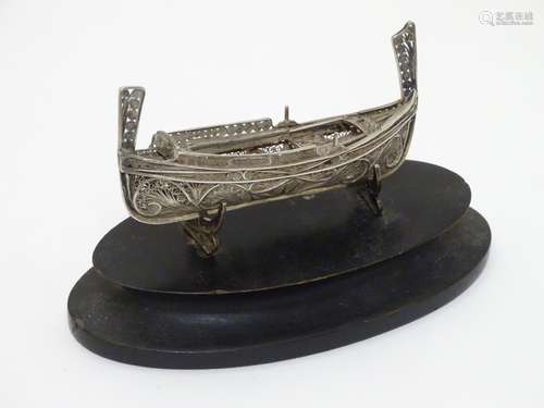 A Maltese 917 silver filigree model of a boat on stand .